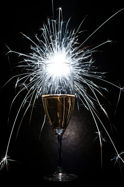 Champagne glass and fireworks — Stock Photo, Image