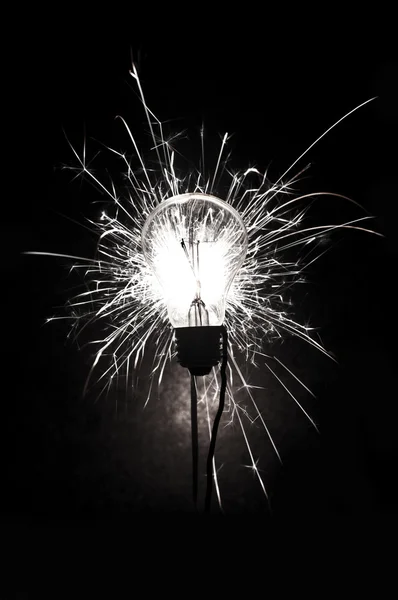 Bulb and fireworks — Stock Photo, Image