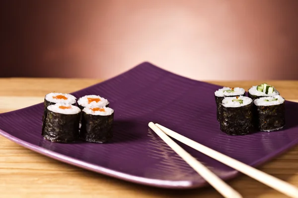 Sushi on the plate with chopstick — Stock Photo, Image
