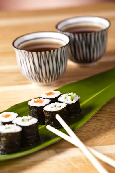 Sushi rolls on the leaf — Stock Photo, Image