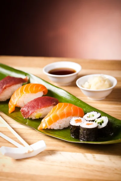 Sushi and rolls on the leaf — Stock Photo, Image