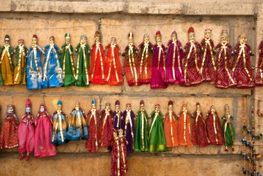 Stock Photo: Colorful handmade puppets on display for sale in Jaisalmer, Rajasthan. clipart