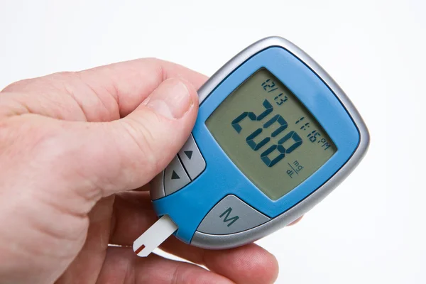 Глюкоза монитор показывает высокий уровень сахара в крови Стоковое Фото