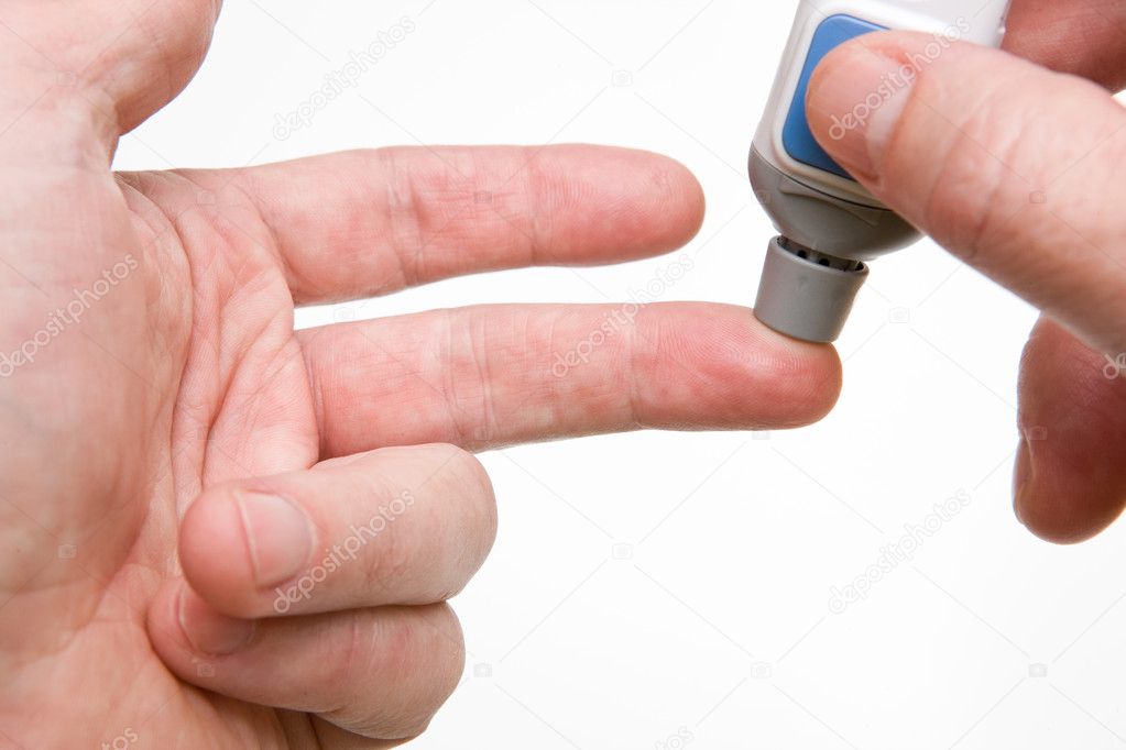 Pricking Finger with Lancet to Test Blood Sugar