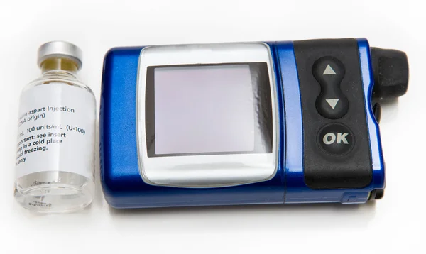 Pompa di insulina e flacone di medicina Fotografia Stock