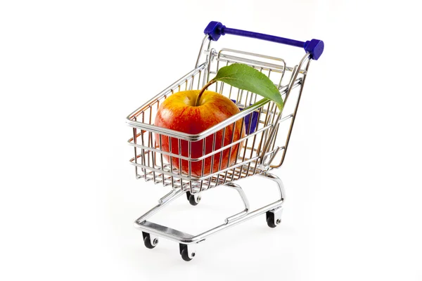 Shopping cart with apple — Stock Photo, Image