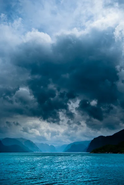 Fjord with dark clouds II Stock Photo