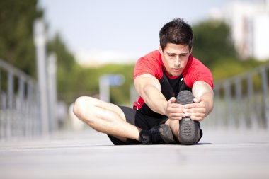 Athlete warming and stretching clipart