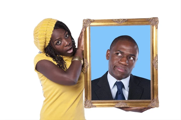 African woman holding a portrait of a businessman — Stock Photo, Image