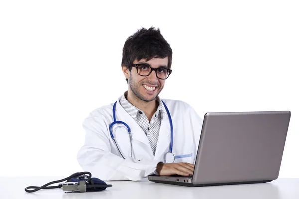 Frendly young doctor working with his laptop — Stock Photo, Image