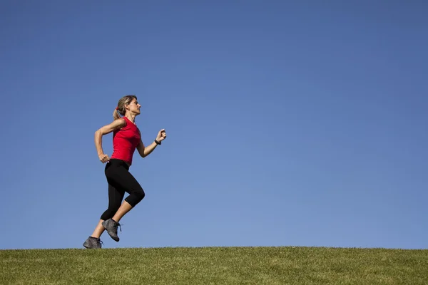 Running at the top of the hill — Stock Photo, Image