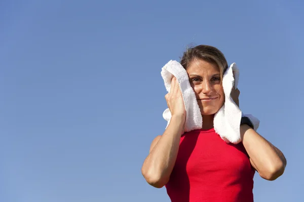 Sport woman with a towel — Stock Photo, Image