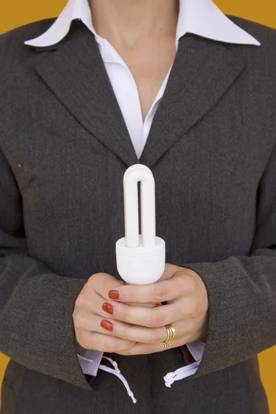 Bir lamba 1 holding iş kadını — Stok fotoğraf