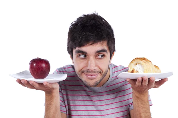 Young man food decision Royalty Free Stock Images
