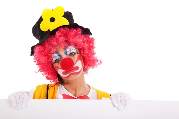 Triste clown tenant une bannière — Photo