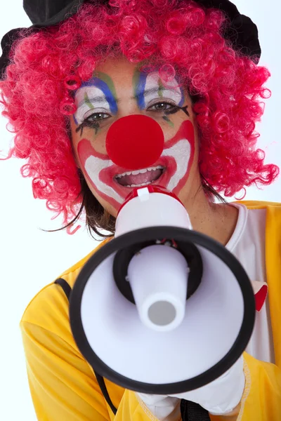 Смешной клоун с мегафоном — стоковое фото