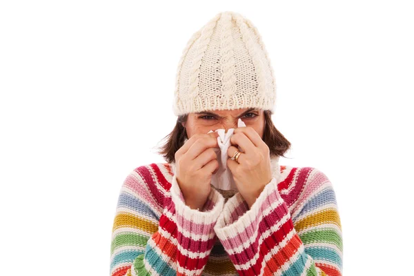 Woman sneezing to a tissue — Stock Photo, Image