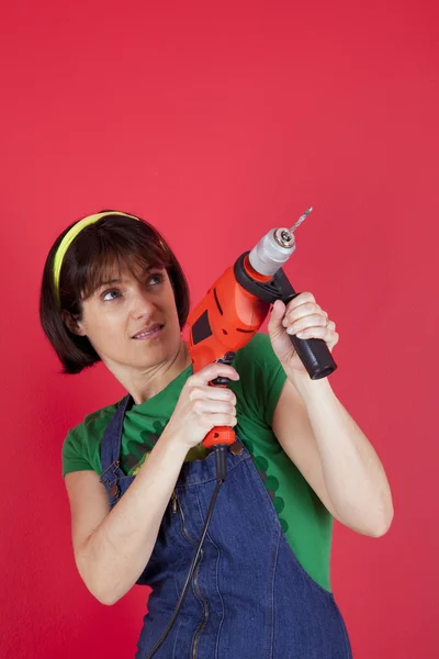 Woman holding a electric drill — Stock Photo, Image