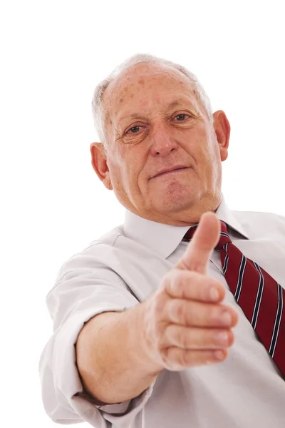 Handshake from a senior businessman — Stock Photo, Image