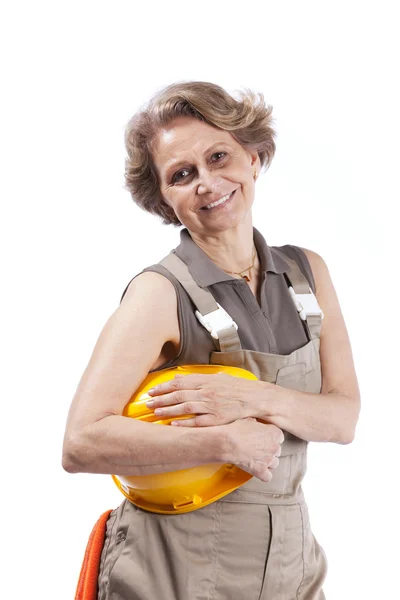 Senior woman with a hardhat — Stock Photo, Image