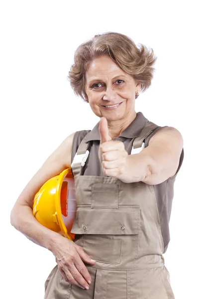 Senior woman with a hardhat — Stock Photo, Image