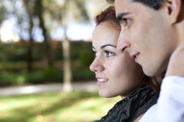 Young couple looking away clipart