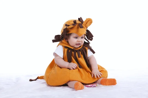 Baby with a lion mask — Stock Photo, Image