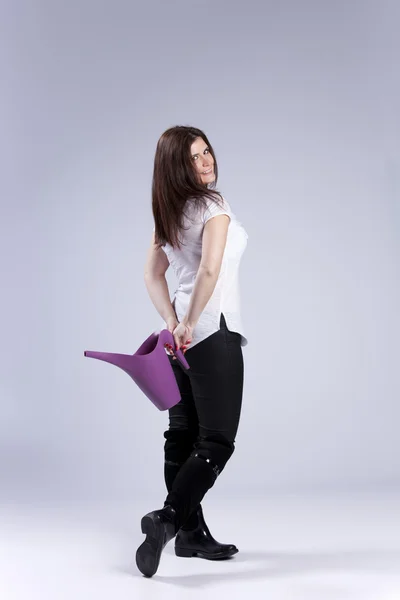 Woman with a watering can — Stock Photo, Image