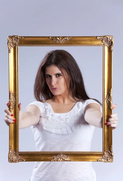 Young woman inside a picture frame — Stock Photo, Image