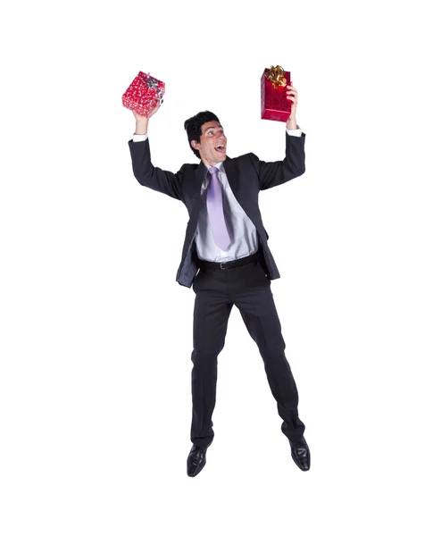 Glad affärsman med julklappar — Stockfoto