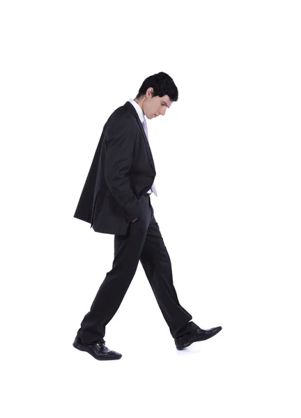 Empresário caminhando e olhando para baixo — Fotografia de Stock