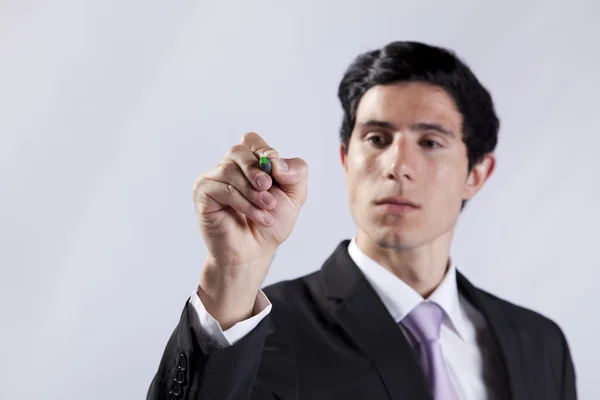 Businessman writing on the whiteboard — Stock Photo, Image