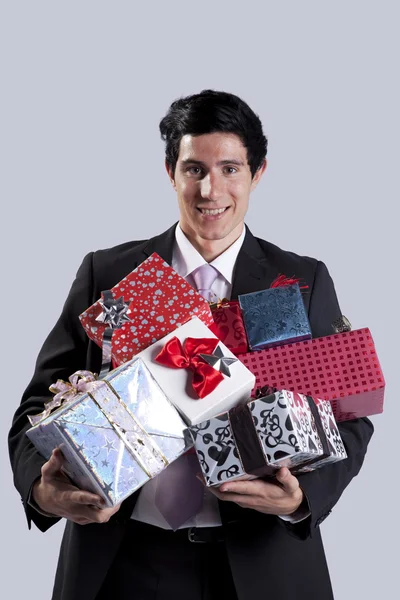 Uomo d'affari con un pacchetto regalo — Foto Stock