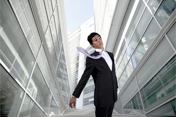 Businessman with a flying necktie — Stock Photo, Image
