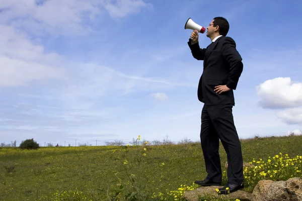 Affärsman tala med en megafon — Stockfoto