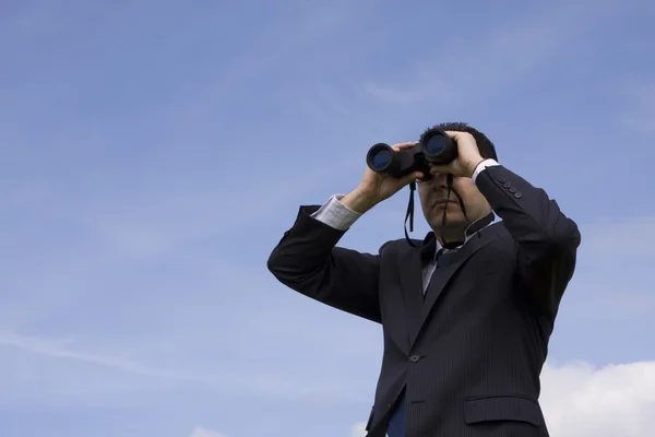 stock image Businessman looking through binoculars