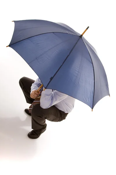 Hiding bewind an umbrella — Stock Photo, Image