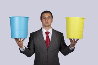 Businessman holding buckets clipart