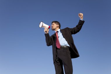 Businessman speaking with a megaphone clipart