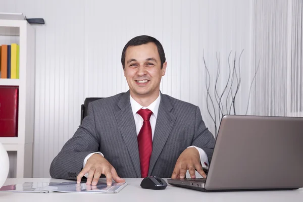 stock image Mature businessman working at the office