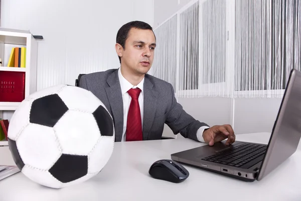 Stock image Soccer manager at the office