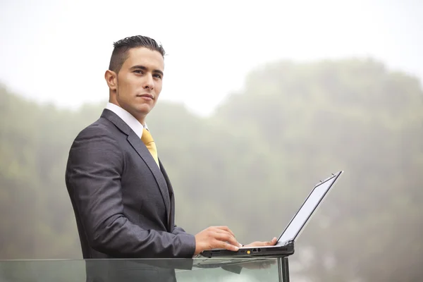 Modern businessman at the office balcony — Stock Photo, Image