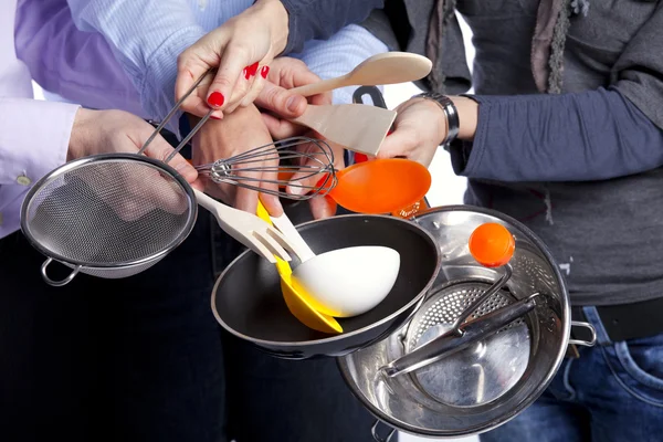 Hands holding kitchenware tools — Stock Photo, Image