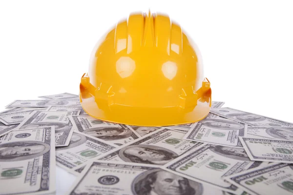 stock image Construction helmet over a lot of money