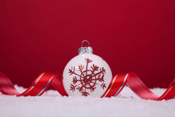 Christmas balls over a red background — Stock Photo, Image