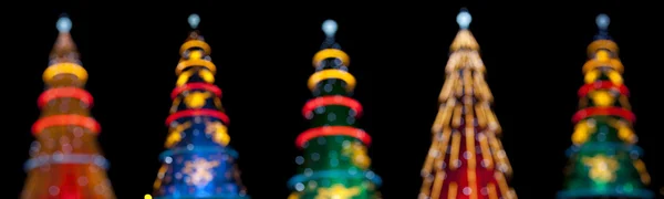 stock image Five christmas tree in the night