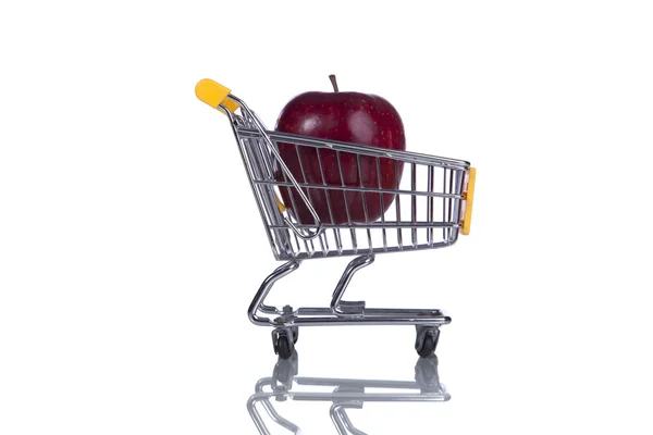 Apple inside a shopping cart — Stock Photo, Image