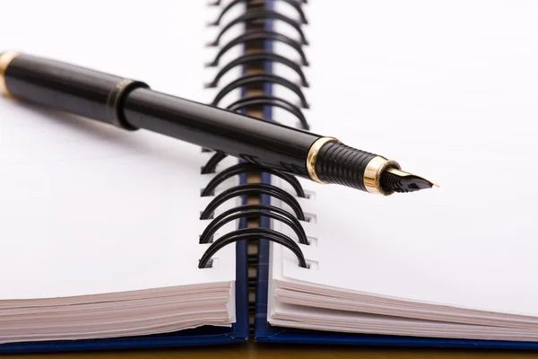 Pen over a notepad — Stock Photo, Image