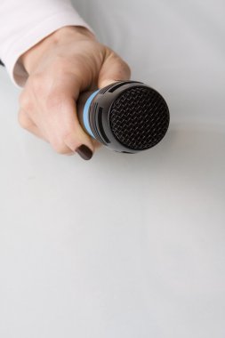 Hand with microphone clipart