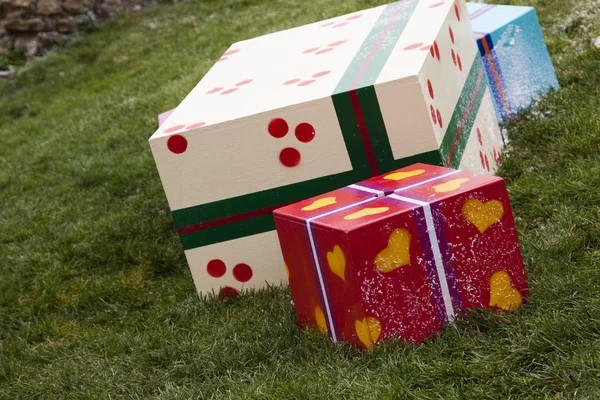 Gift boxes in the grass — Stock Photo, Image